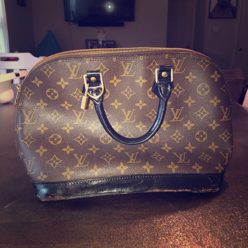 Louis Vuitton Authentic...has some damage.